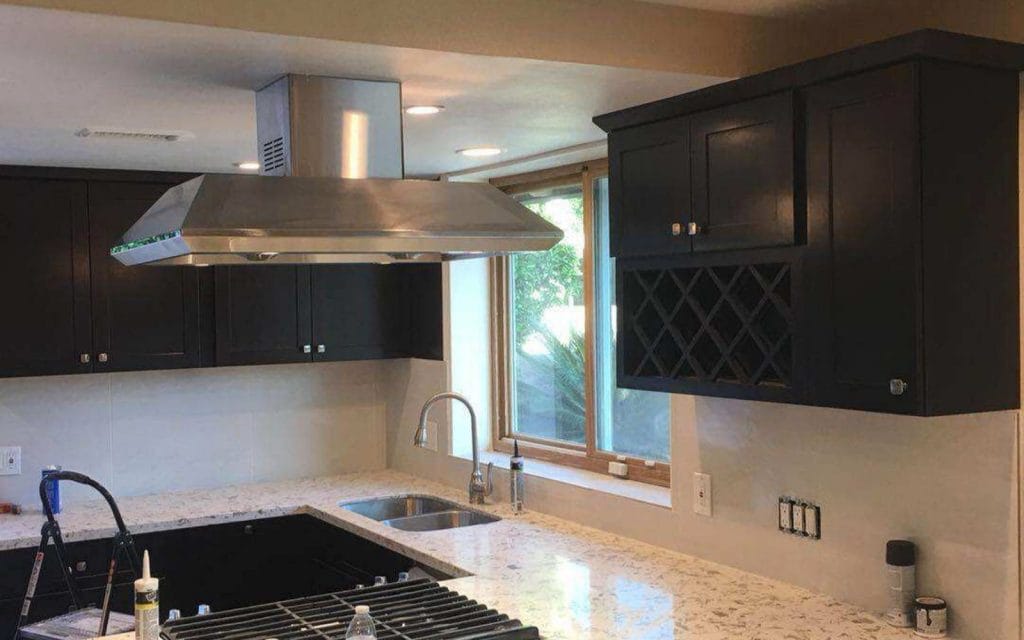 Newly Stained Dark Kitchen Cabinets - All Climate Painting and Remodeling