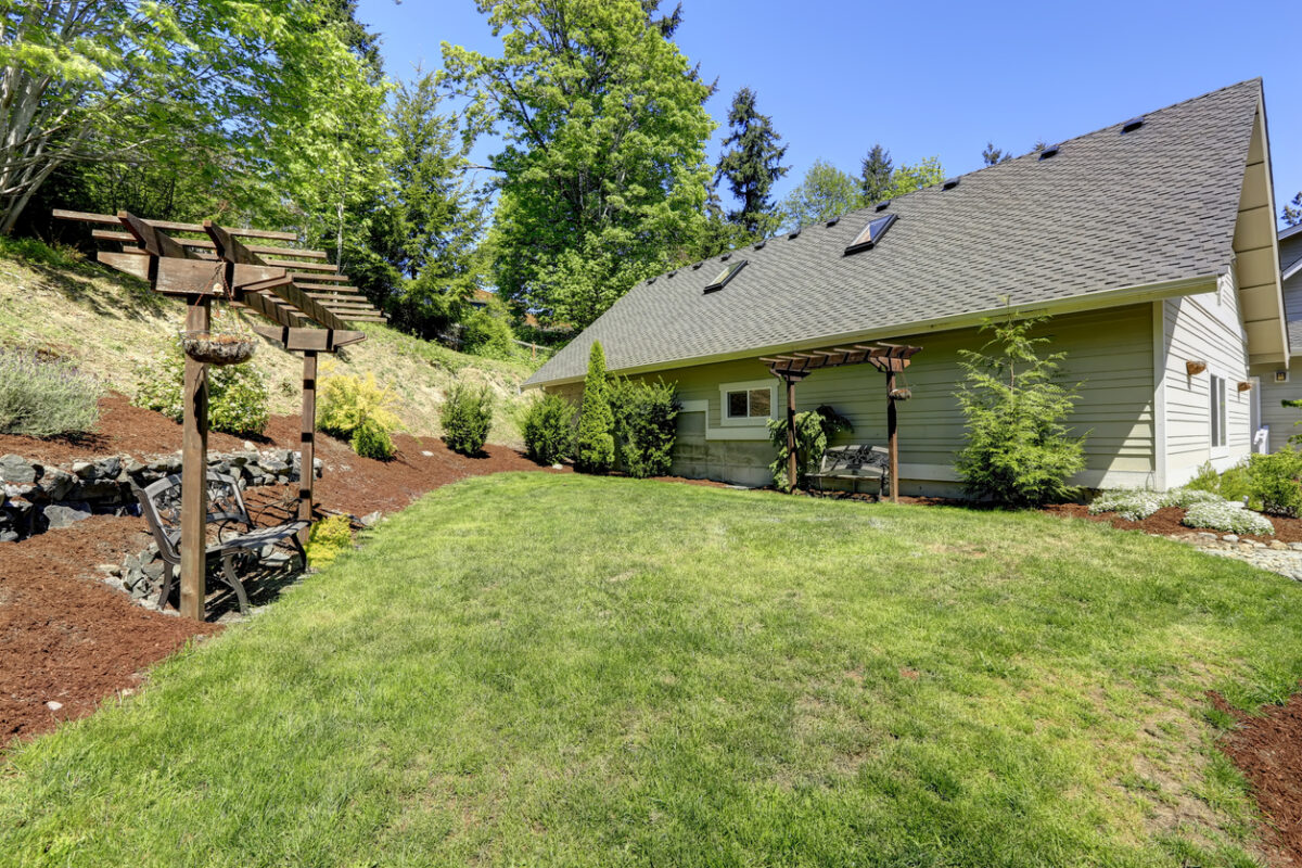 Effective Sloped Yard Drainage Solutions to Prevent Water Damage - All Climate Painting